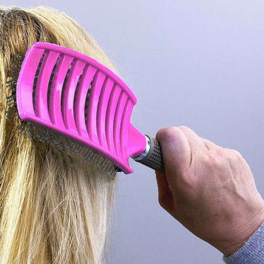 "Say goodbye to tangles with the Detangling Hairbrush, designed for effortless, pain-free brushing. Its flexible bristles glide through hair, gently detangling knots without causing breakage or discomfort. Perfect for all hair types, this brush works on w